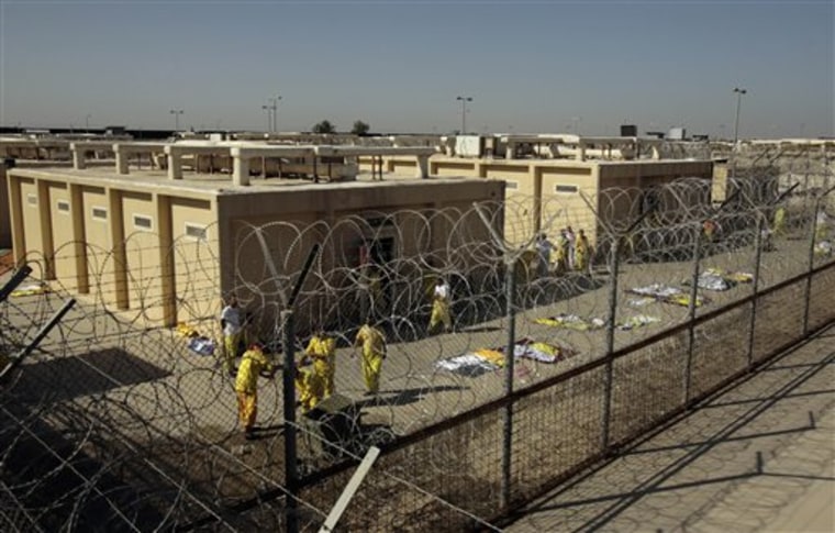 Detainees are seen outside their cell block at the U.S. detention facility at Camp Cropper in Baghdad, Iraq.  